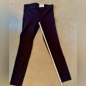 Black stretch pants with button trim